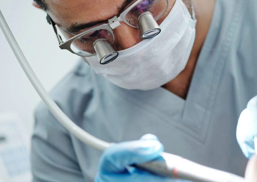 Insertion of dental implant by dentist at Zahnärzte Neustadt Passage